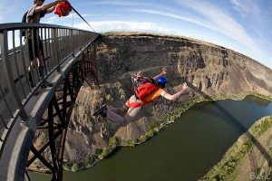 Base jumping over a river