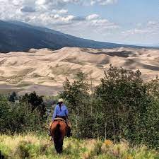 Someone riding a horse at a ranch