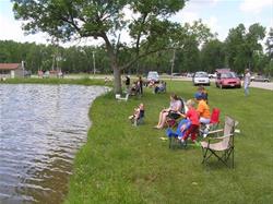 People fishing in a pond