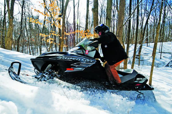 Man riding a snowmobile in the snow