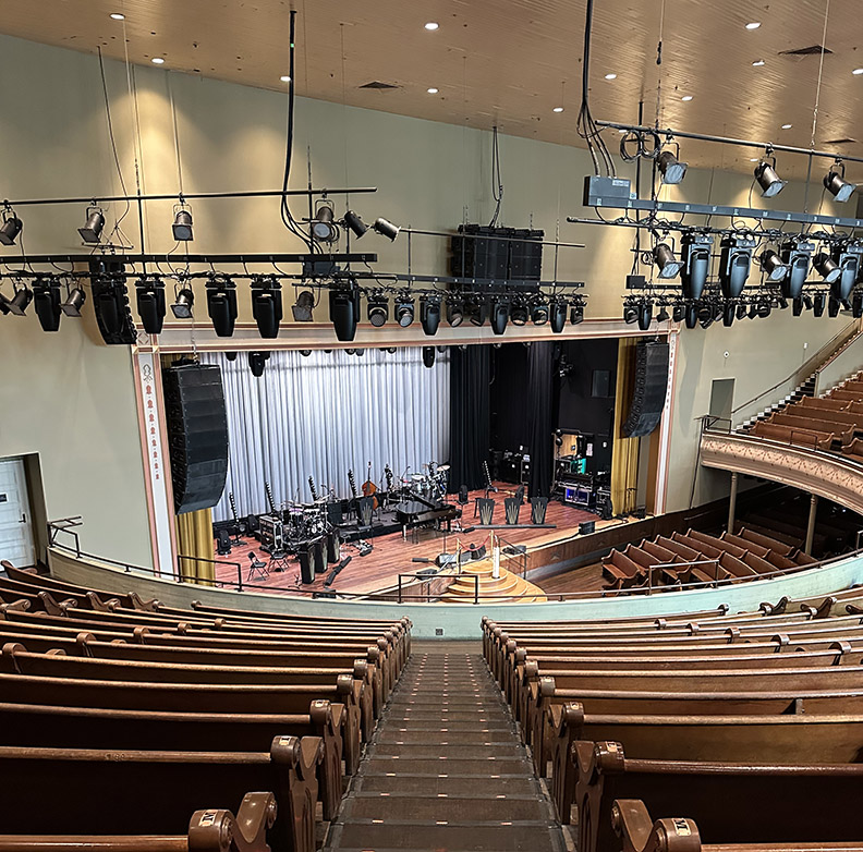 Empty Stage and audience seats at the Ryman Auditorium