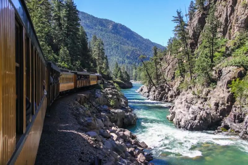 Train going by a river