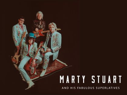 Narty Stuart and his band members posed in light green matching suites