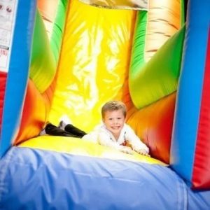 A kid in a bounce house