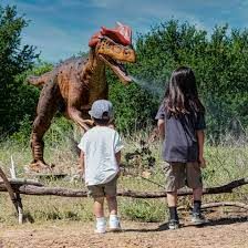Kida looking at a dinosaur