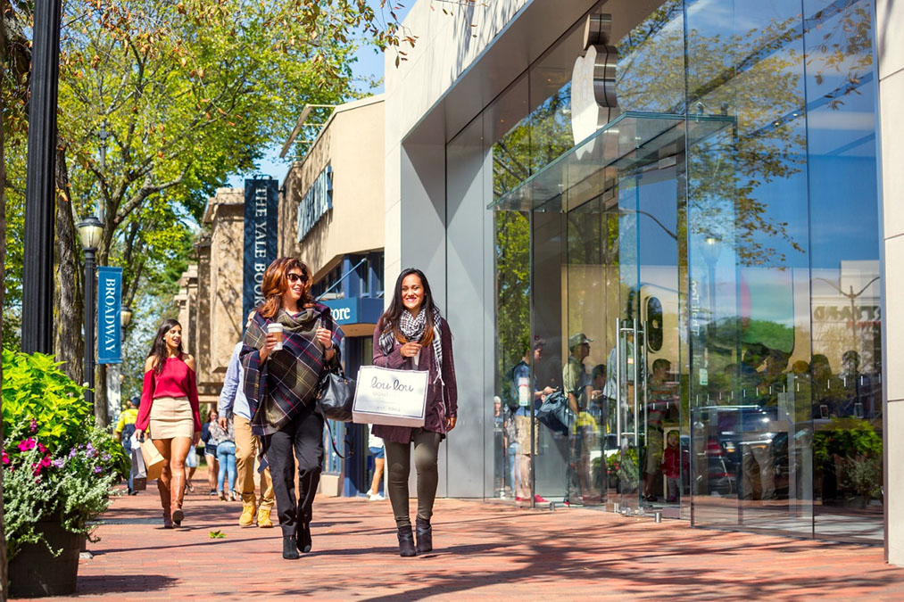 Two women shopping in a downtown area
