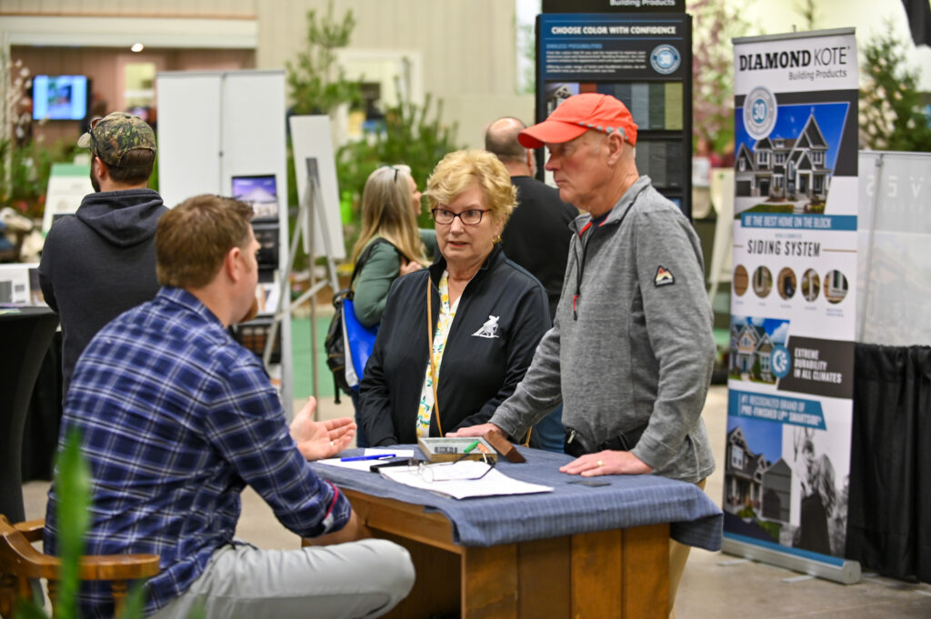 Man and women gathering information from home show booth in Cleveland