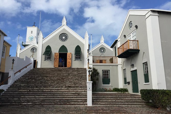 Exterior view of steps leading up to a white church front