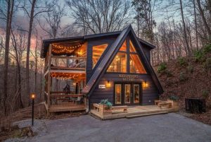 A beautiful rental cabin lit up at night
