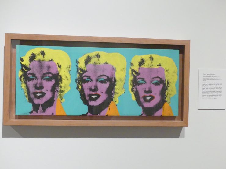 Artwork on the wall of three abstract headshots of Marilyn Monroe