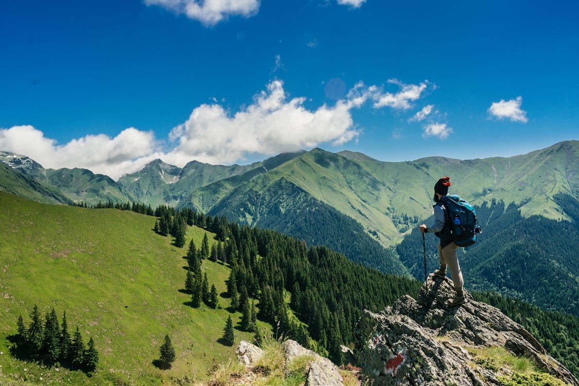 Hiker overlooking mountains