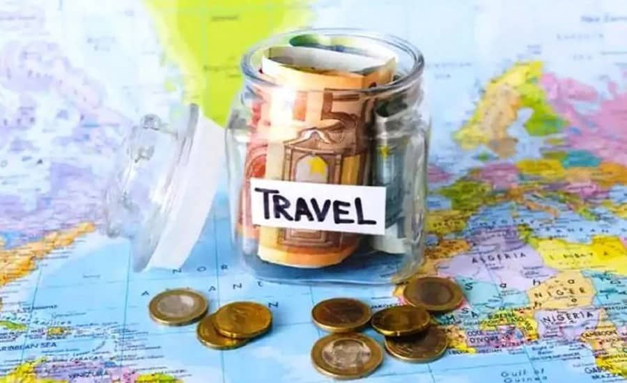 Travel money jar sitting on a map