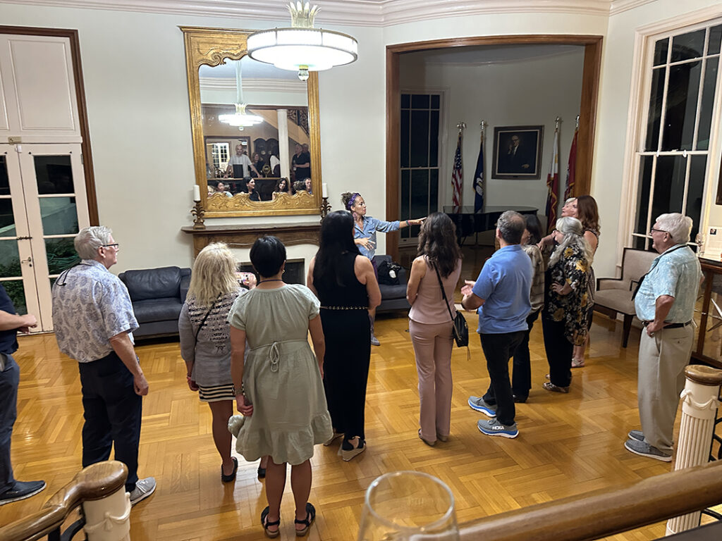 group of people excercising in a well lit room