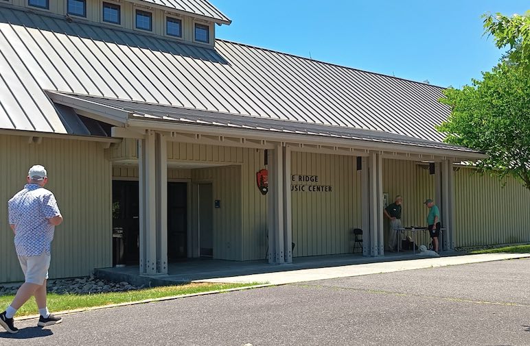 A man walking toward the exterior doorway of Blue Ridge Center 