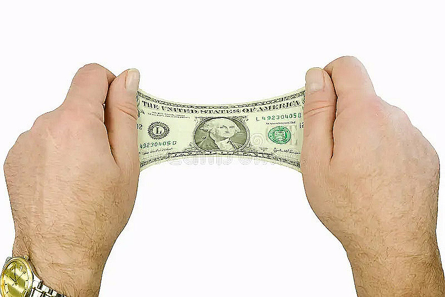 hands trying to stretch a dollar bill
