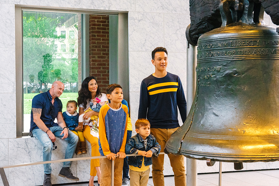 Family looking at the original liberty Bell in PA
