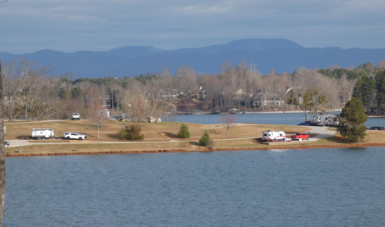 airial view of lake and mountains in background