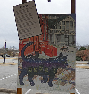 a mural of a cat standing on a street corner