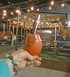 red drink held in hand