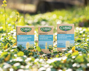 CURAD boxes displayed in the grass