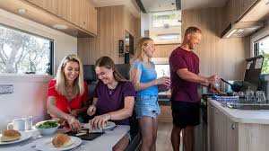 Family enjoying a meal in an RV