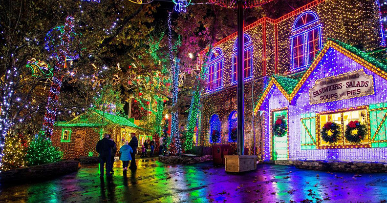 Silver Dollar City streets lit for christmas lights at night.