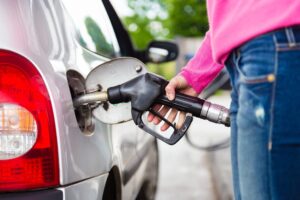 Someone pumping gas into their car