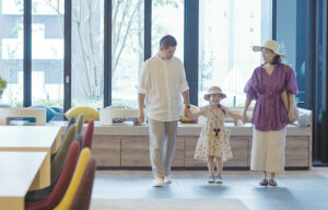Family holding hands inside a Hyatt Hotel