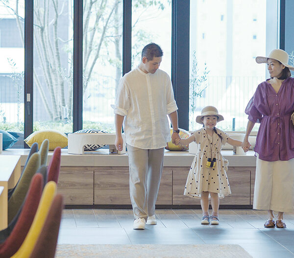 Family holding hands inside a Hyatt Hotel