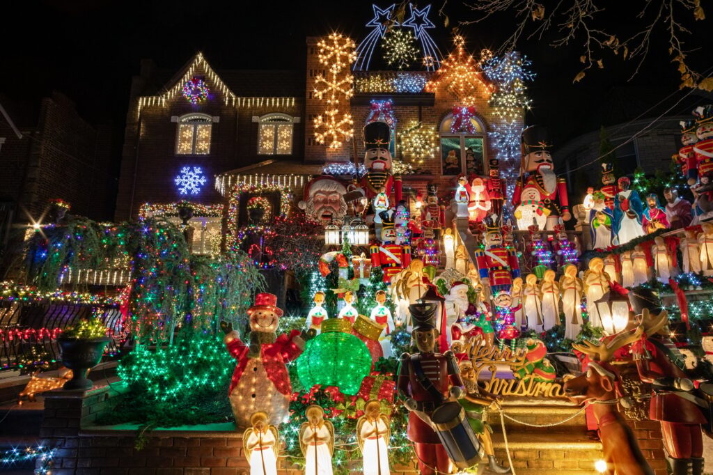 two-story house decorated with Christmas lights