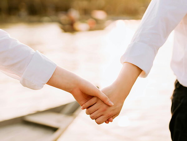 Closeup of a couple holding hands