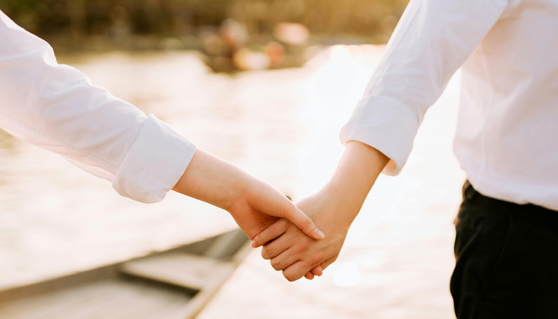 Closeup of a couple holding hands