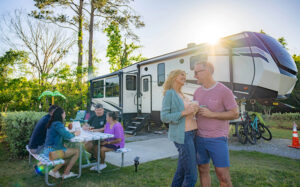 A family spending time together outside an RV