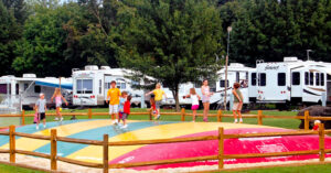 A lot of kids playing together at an RV park