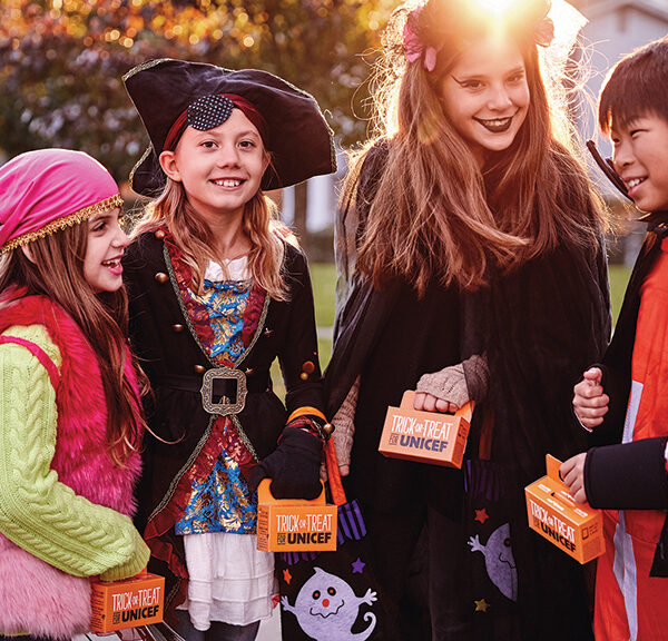 Kids dressed up in Halloween Costumes