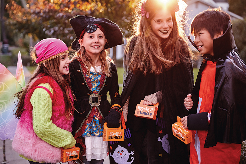 Kids dressed up in Halloween Costumes