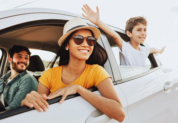Child and parents in a car