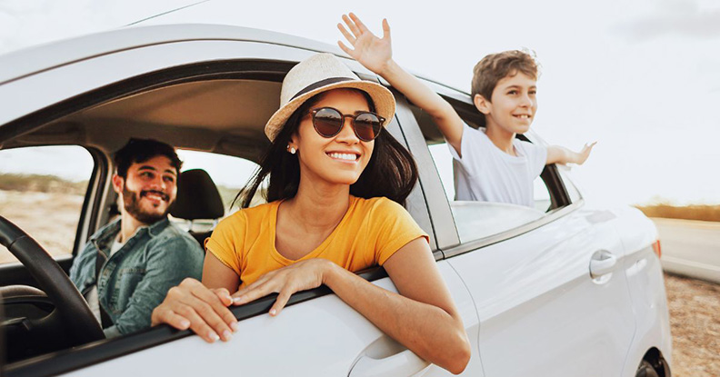 Child and parents in a car