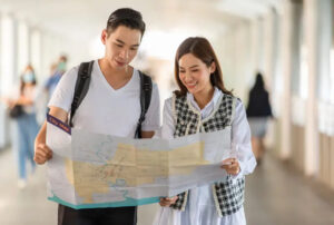 Two people looking at a map travel planning