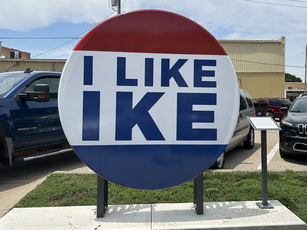 lifesized red, white, and blue round button that says I like Ike