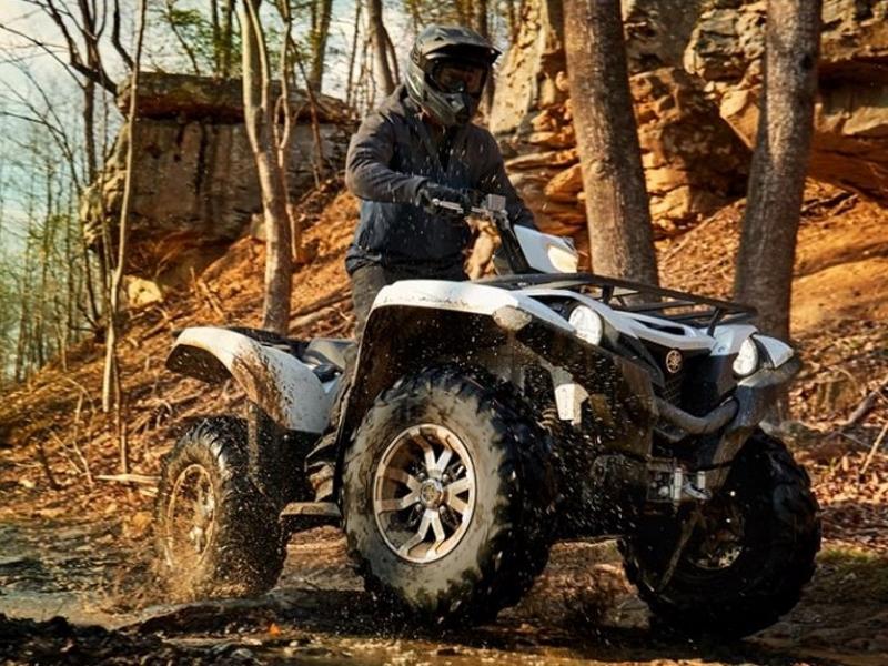 muddy tires on an atp through wooded area