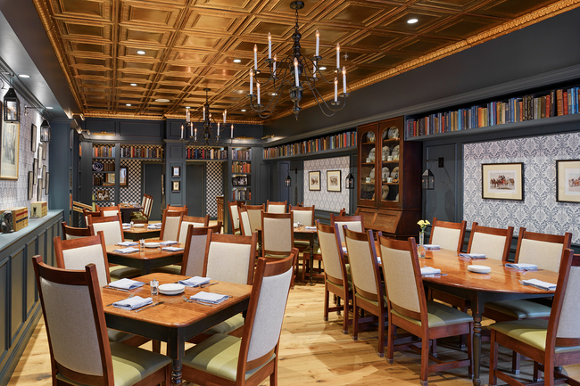 dining tables set in a line in a long hall restaurant,ready for a meal 