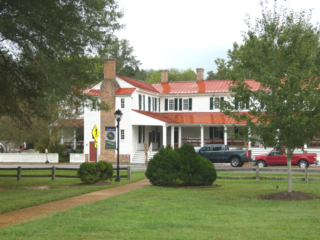 two story colonial home with red roof