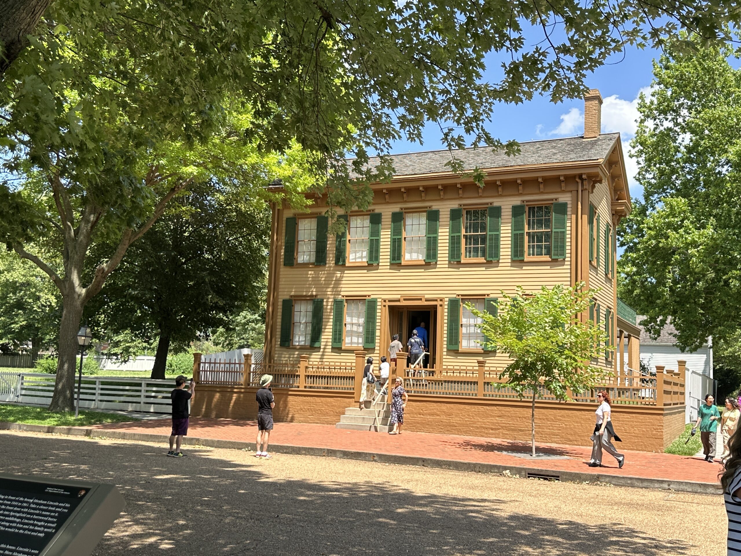 A brown house with green shutters