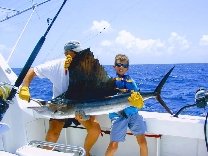 Man and boy with sailfish