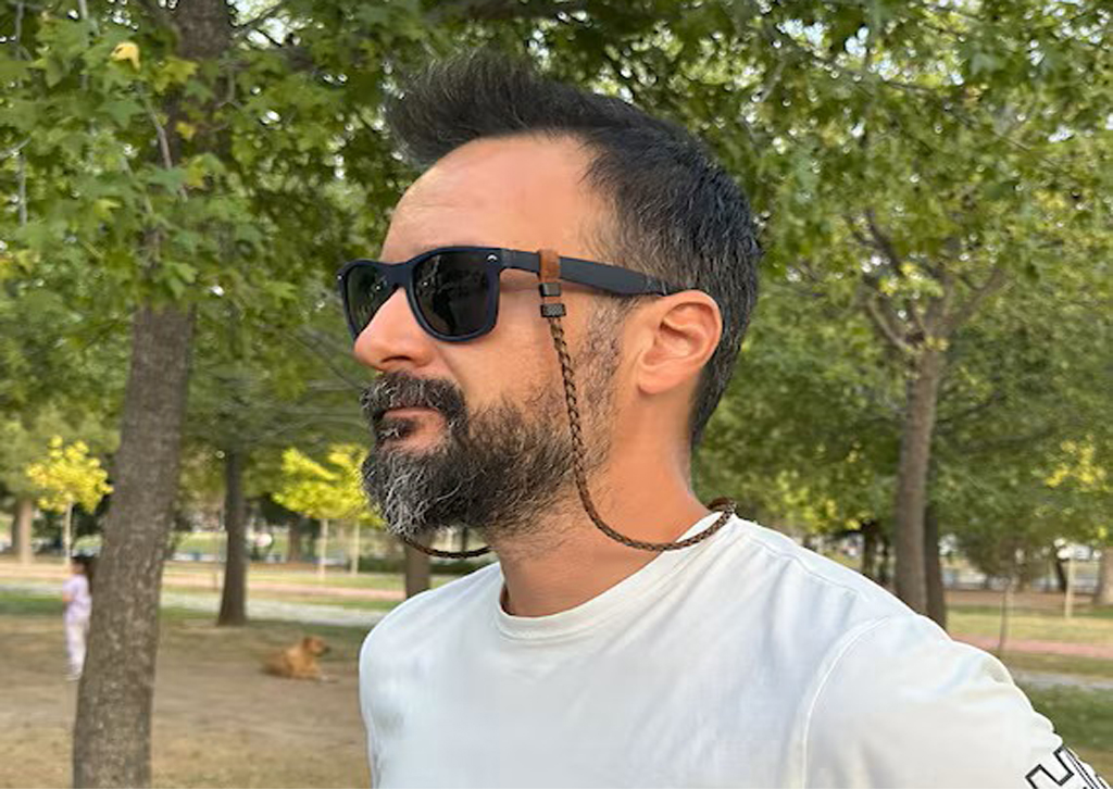 A man showing glasses strap 