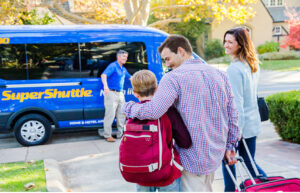 Family walking towards a shuttle van 
