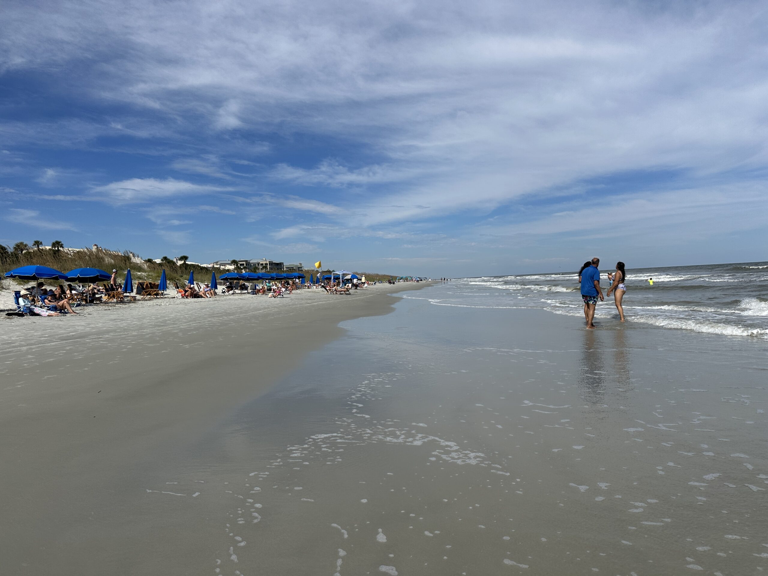 a couple walking on the beach