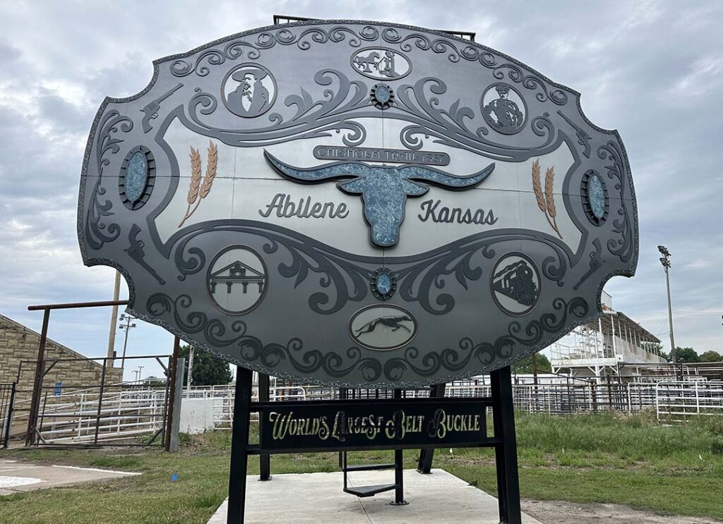 giant poster of a belt buckle representing the city of abilene Kansas 