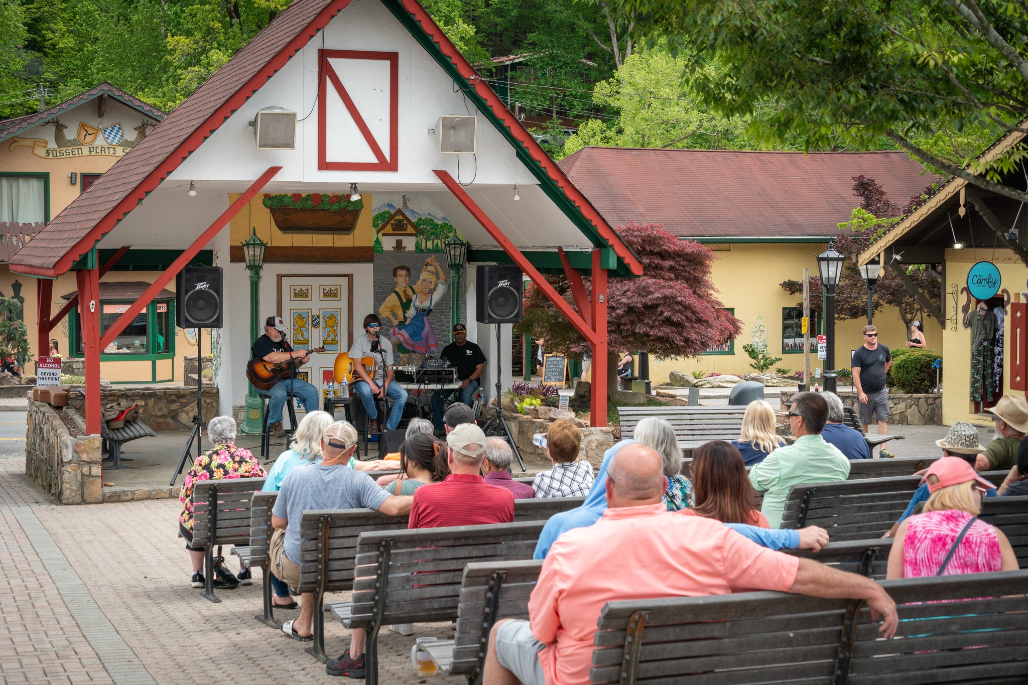 Bavarian style building with people in audiance.
